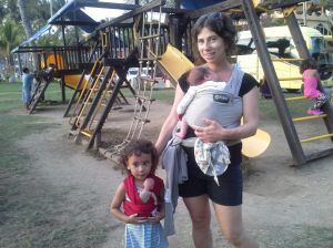 Out and about with our matching wraps. Lucia takes care of her baby, too. 
