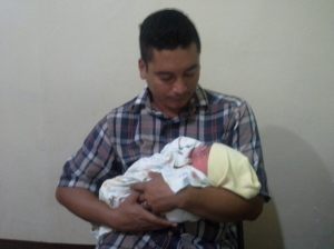 This one's pretty normal! The baby with his papi, shortly after birth. 